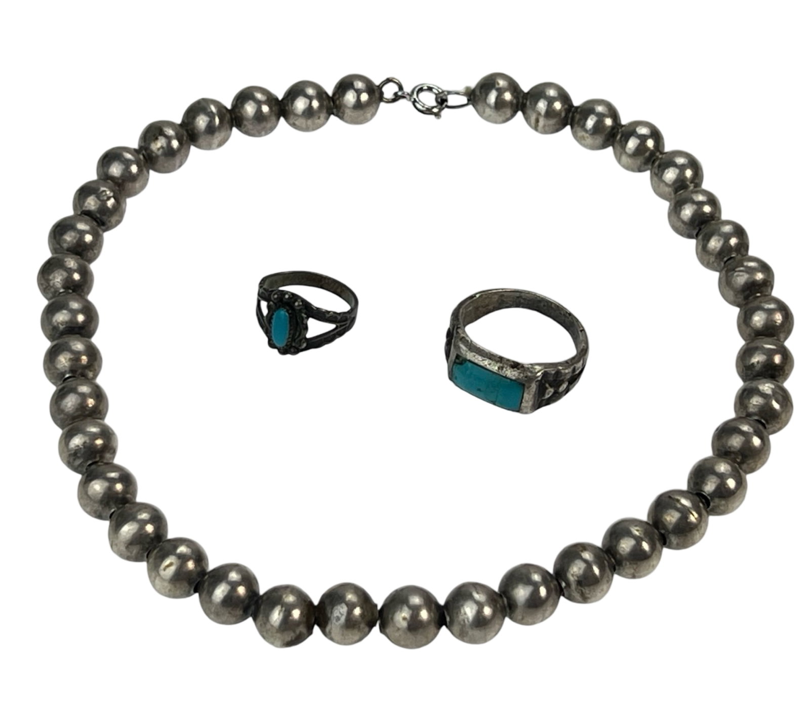 Native American Navajo Sterling Silver Jewelry: Native American Navajo Sterling Silver Jewelry including Choker Necklace with Large Sterling beads and Two Rings inlaid with Turuqoise. Necklace is 14" long, Ring sizes- 9 3/4 & 3.