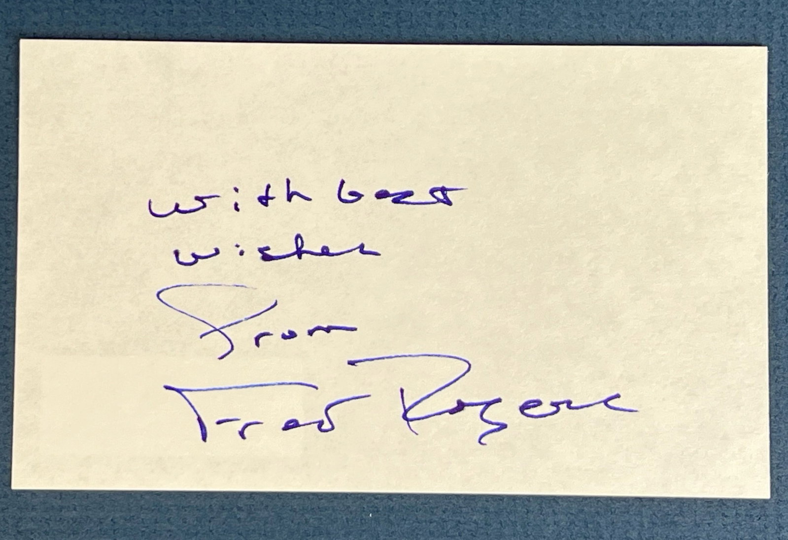 Fred Rogers Autograph/ Signature: A heartfelt autograph from Fred Rogers, beloved host of "Mister Rogers' Neighborhood," on a 3" x 5" card. Written in blue ink, the message reads "with best wishes" followed by his signature, "Fred Rog