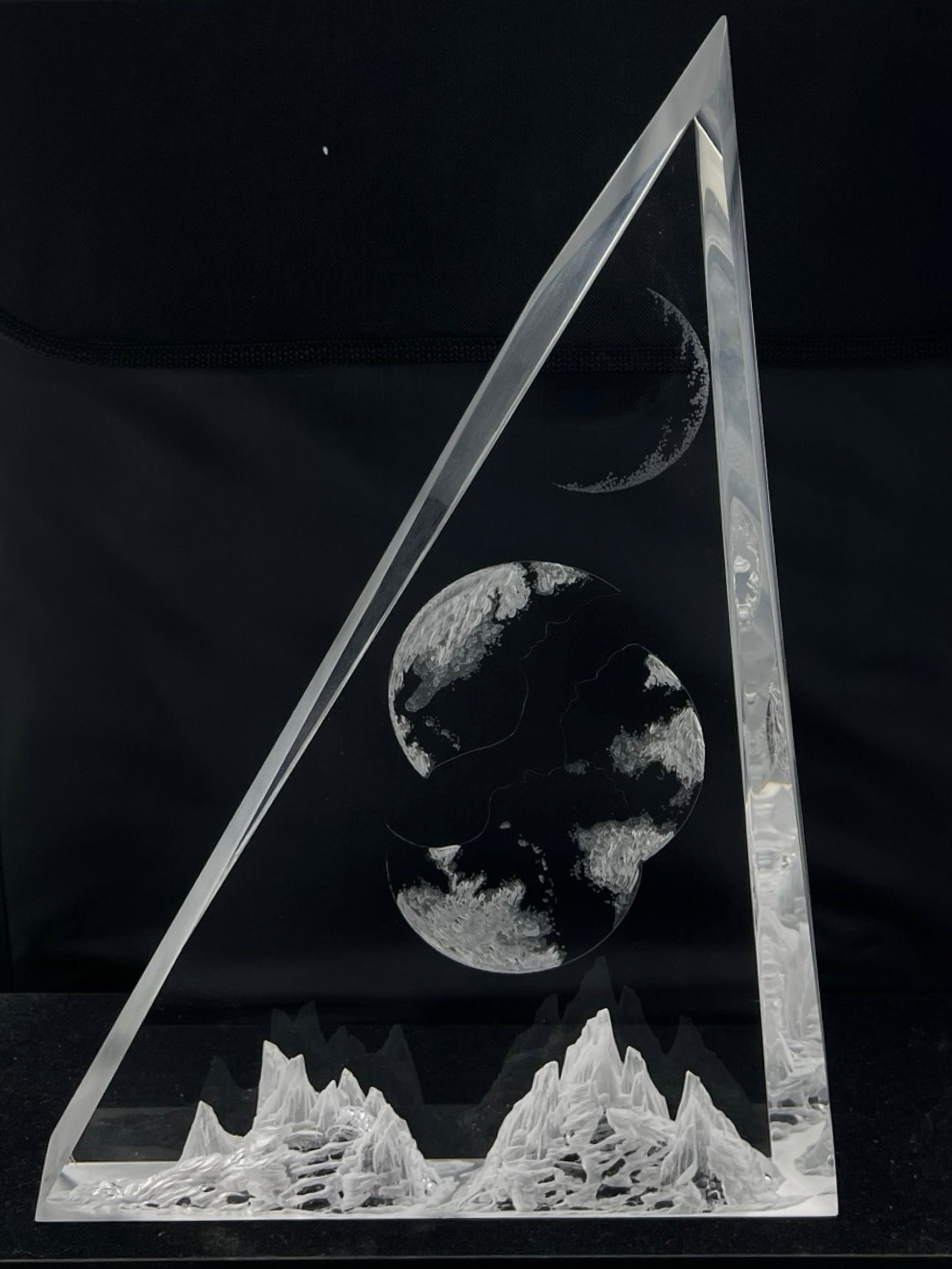 Denise Ritz "Moonscape" Carved Acrylic Sculpture: A captivating carved acrylic sculpture by Denise Ritz. This striking piece, titled Moonscape, features intricate details of a moonscape, with the surface of the moon and other celestial elements delic