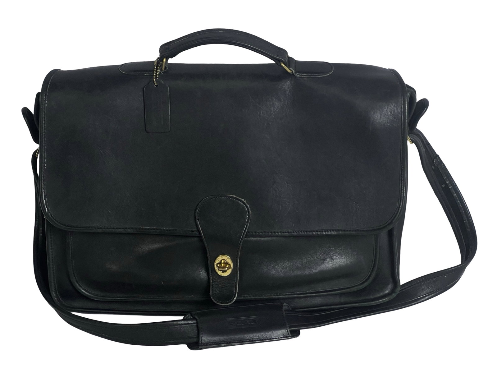 Coach Metropolitan Black Leather Laptop Bag: This classic Coach Metropolitan Laptop Bag combines timeless elegance with functional design, perfect for professionals and collectors alike. Crafted from premium black leather, this bag features Coac