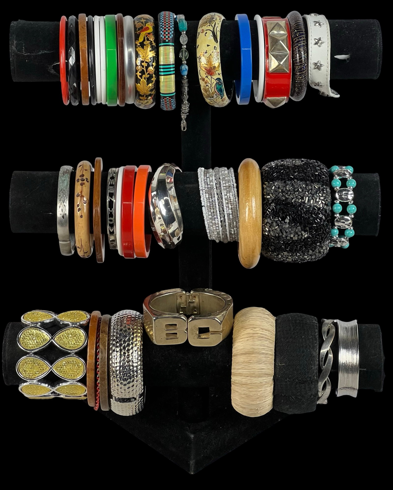 Collection of Lady's Bracelets: Explore a diverse assortment of bracelets, each one offering its own unique style and charm. Display stands are not included.