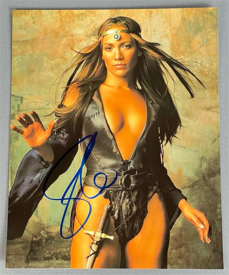 Jennifer Lopez Autographed Photograph: A captivating autographed photograph of Jennifer Lopez dressed in a fantasy warrior outfit. A stunning collectible for fans of the global superstar, this piece adds an exciting and dramatic touch to a