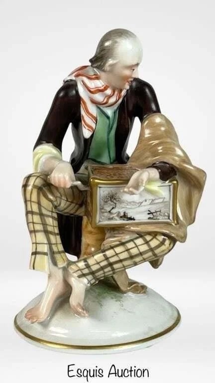 Vienna Augarten Porcelain Organ Grinder Figurine: A charming porcelain figurine by the esteemed Vienna Augarten, depicting a street organ grinder. The figure is intricately painted, showcasing the grinder in a moment of performance, his instrument de