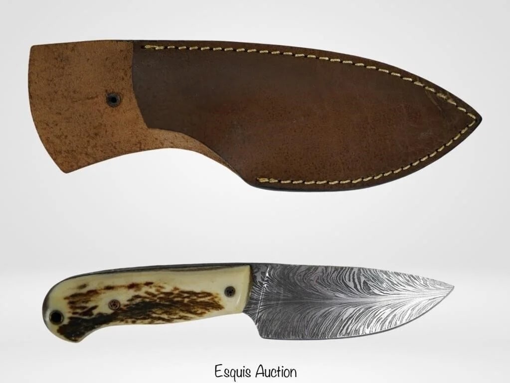 Damascus Steel Feather Knife by Hunan Mugal: Damascus Steel Feather Hunter Knife by artist Hunan Mugal. Comes with Leather Sheath. Full length- 8 1/4", Blade-4 3/8". Mint/ near mint condition.