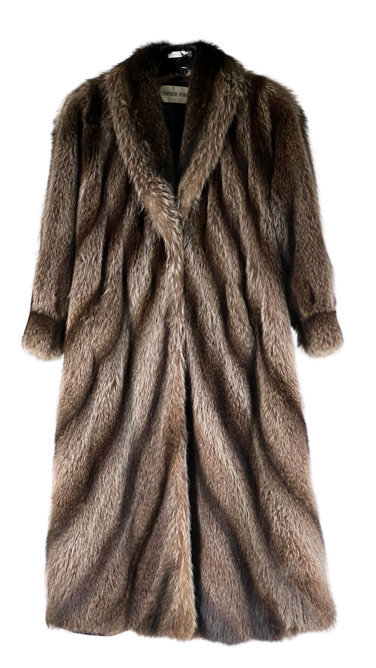Vintage Genuine Raccoon Fur Lady's Coat- L: This exquisite vintage raccoon fur coat by Traeger Furs features luxurious, natural raccoon pelts showcasing beautiful shades of brown with striped highlights. Measuring 48 inches in length, this coat