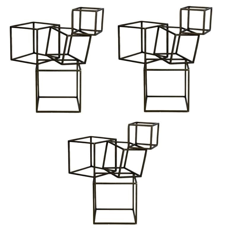 Trio of Modernist Metal Open Cube Sculptures: This striking trio of Modernist metal open cube sculptures embodies the essence of minimalist design with a contemporary twist. Each sculpture stands 16 inches tall, and the set features three interco