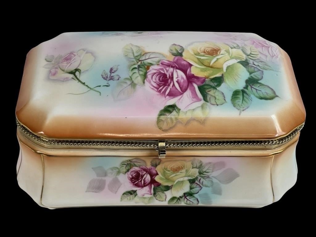 RS Prussia Antique Porcelain Jewelry Box: This beautiful RS Prussia porcelain box, adorned with roses, features vibrant pink, yellow, and purple floral motifs on a gradient pastel background. Ideal for storing jewelry or keepsakes, it is an e