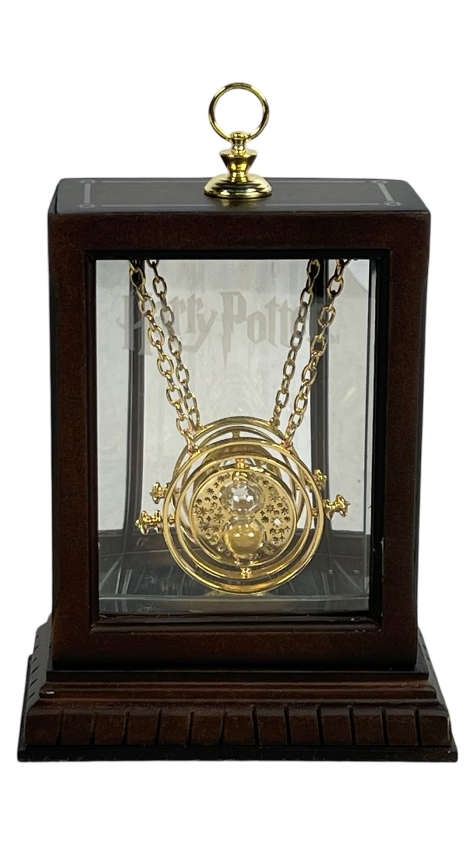 Harry Potter Time Turner Necklace by Noble Collect: This exquisite replica of the Time Turner necklace, as seen in the Harry Potter series, is crafted by Noble Collection. The piece comes beautifully showcased in a wooden and glass display case for an 