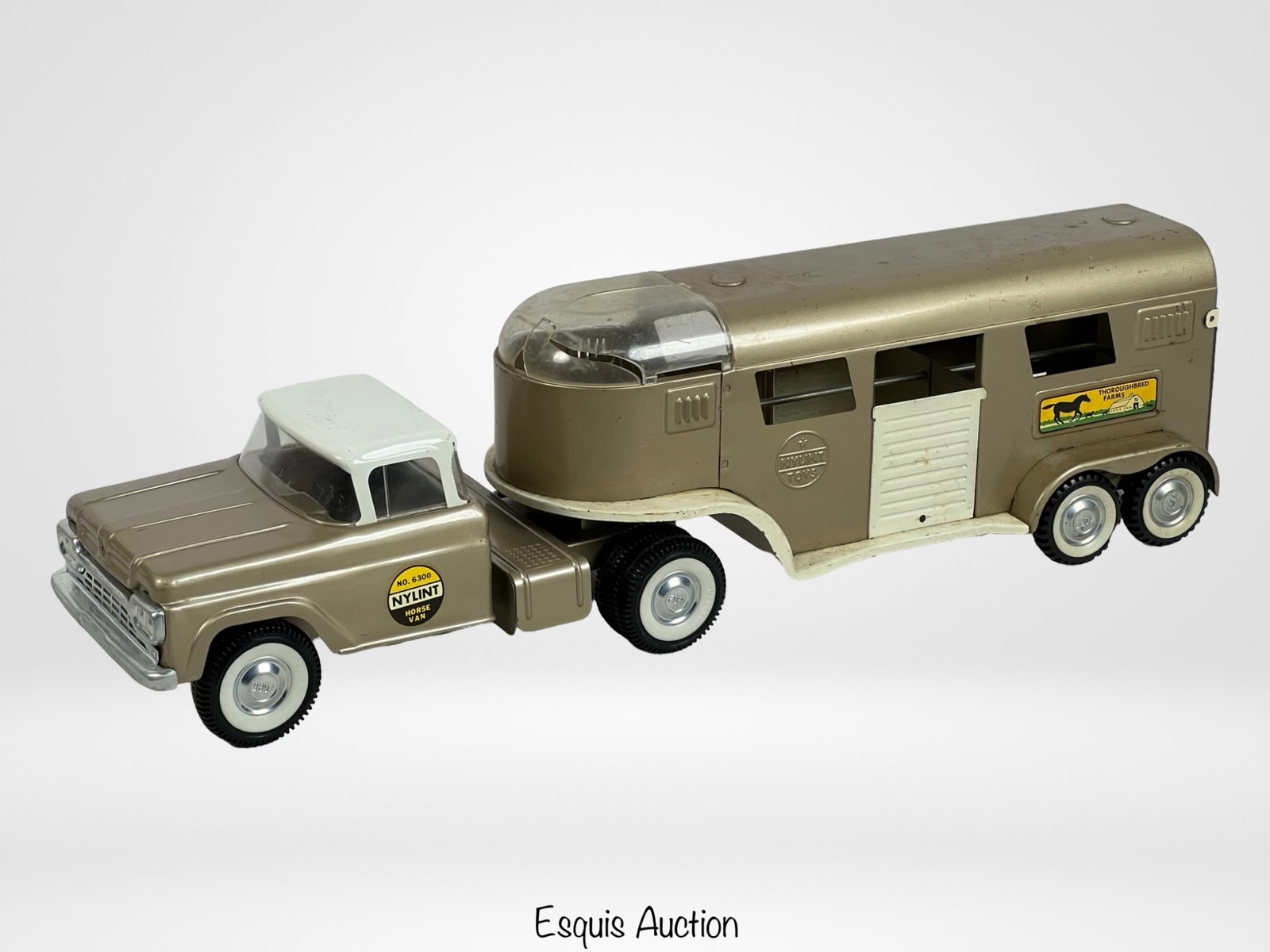Nylint Thoroughbred Farms Horse Truck & Trailer: Vintage Nylint 6300 Thoroughbred Farms Pressed Steel Horse Truck & Trailer from 1960s. Good well-preserved condition with minimum wear with no rust, domed plastic glass on trailer is cracked.