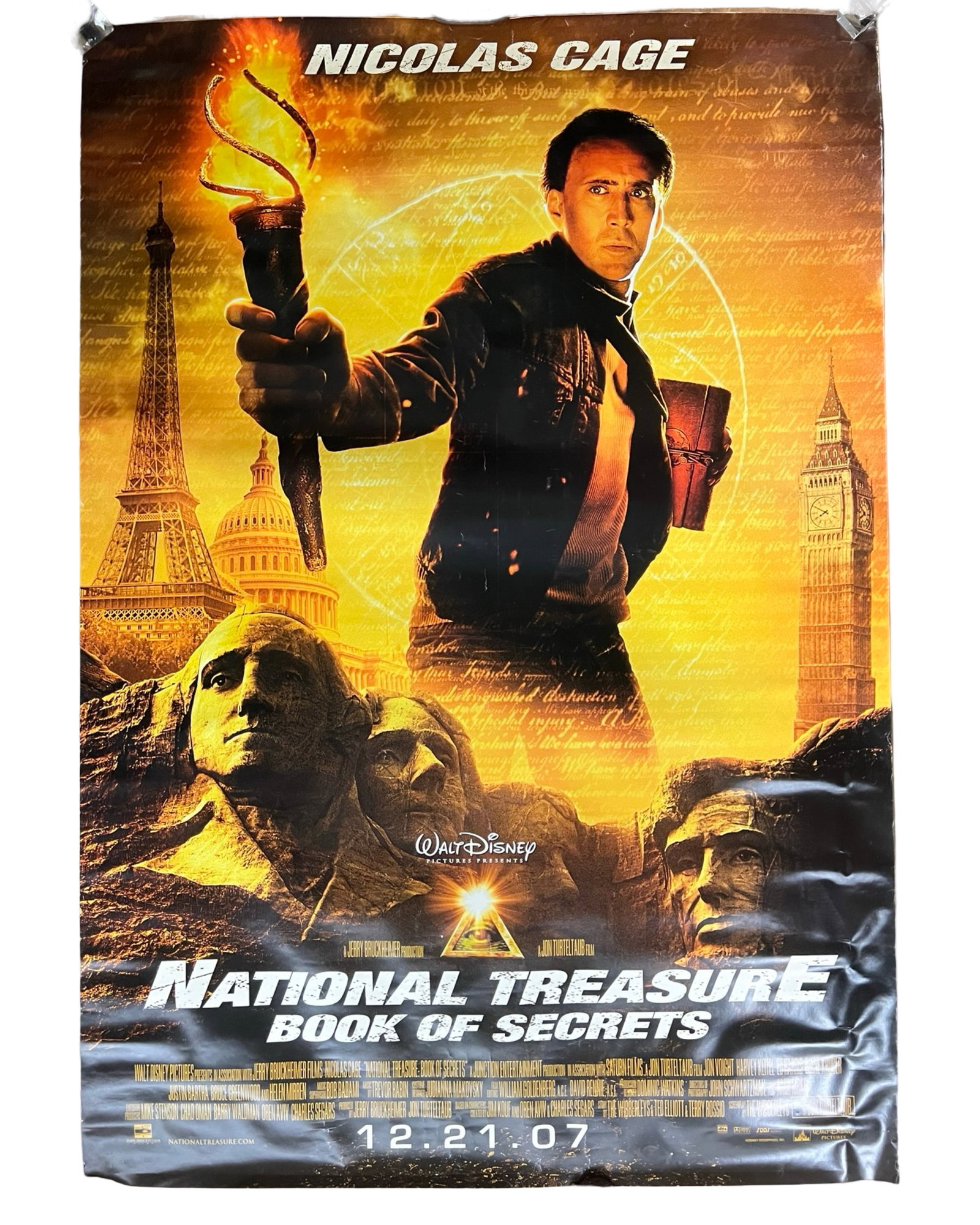 National Treasure:Book of Secrets Bus stop Poster: Official 2007 double sided bus stop movie poster for Disney's "National Treasure: Book of Secrets" starring Nicolas Cage. Features vibrant artwork showcasing iconic landmarks such as Mount Rushmore, B