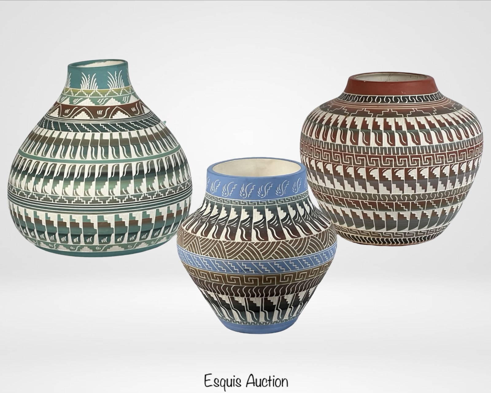 : Navajo Art Pottery Vases by Danis Willie: This set includes three beautifully handcrafted Navajo art pottery vases by Danis Willie, known for his intricate geometric and symbolic designs. Each vase showcases a harmonious blend of earthy tones