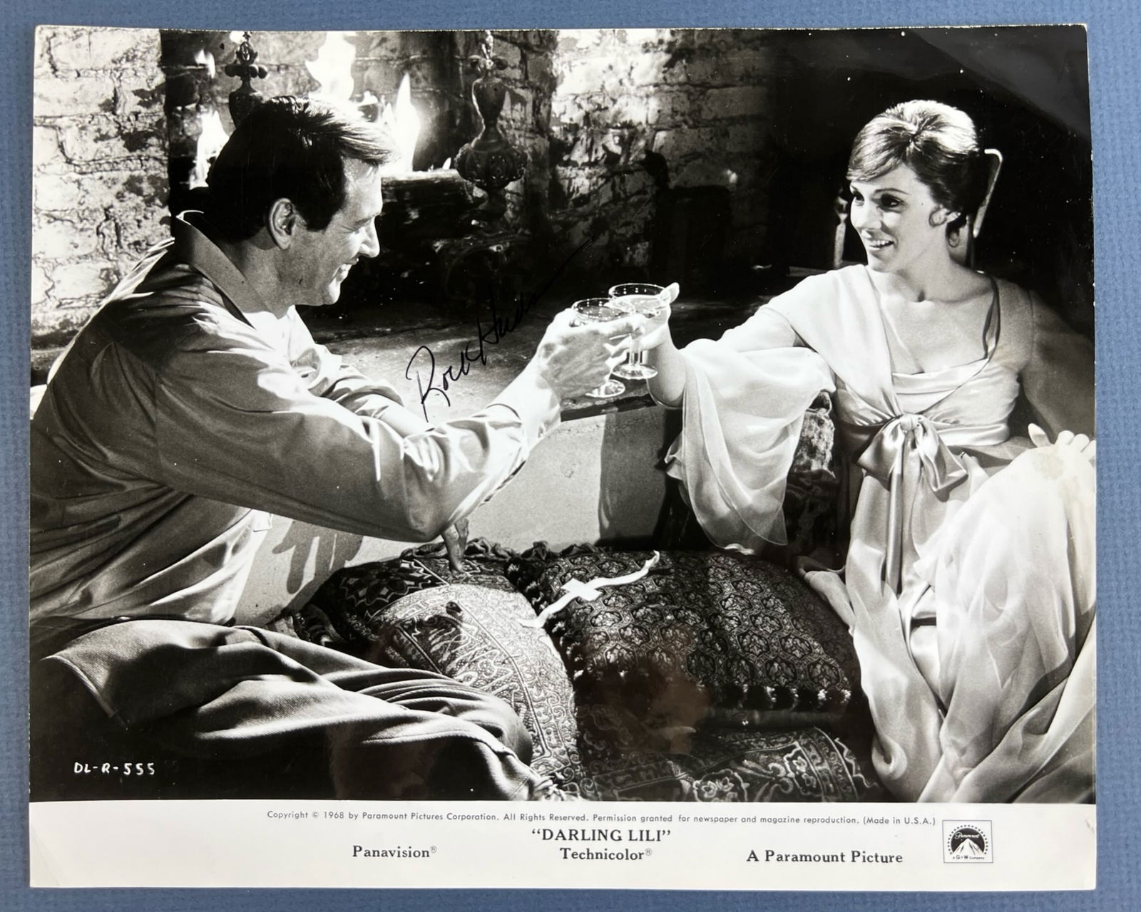 Hudson Autographed Darling Lili Promo Lobby Card: A vintage black-and-white promo lobby card for the 1968 film Darling Lili, featuring Rock Hudson and Julie Andrews. Autographed by Rock Hudson. A classic piece of Hollywood memorabilia.8" x 10". Good