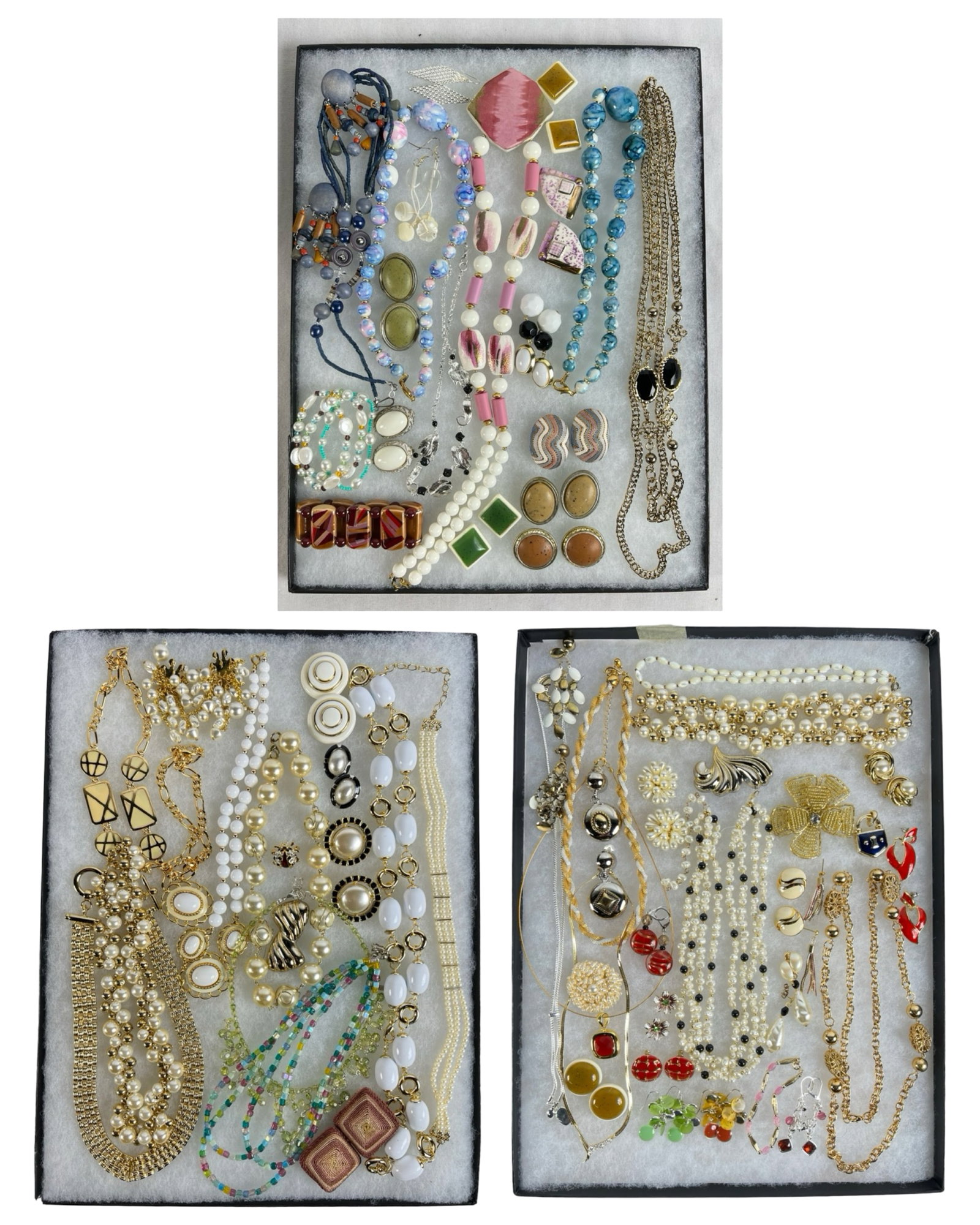 Collection of Costume Jewelry: A curated selection of vintage and contemporary costume jewelry, including necklaces, bracelets, earrings, and brooches. Features vibrant colors, intricate designs, and a variety of materials. Perfect