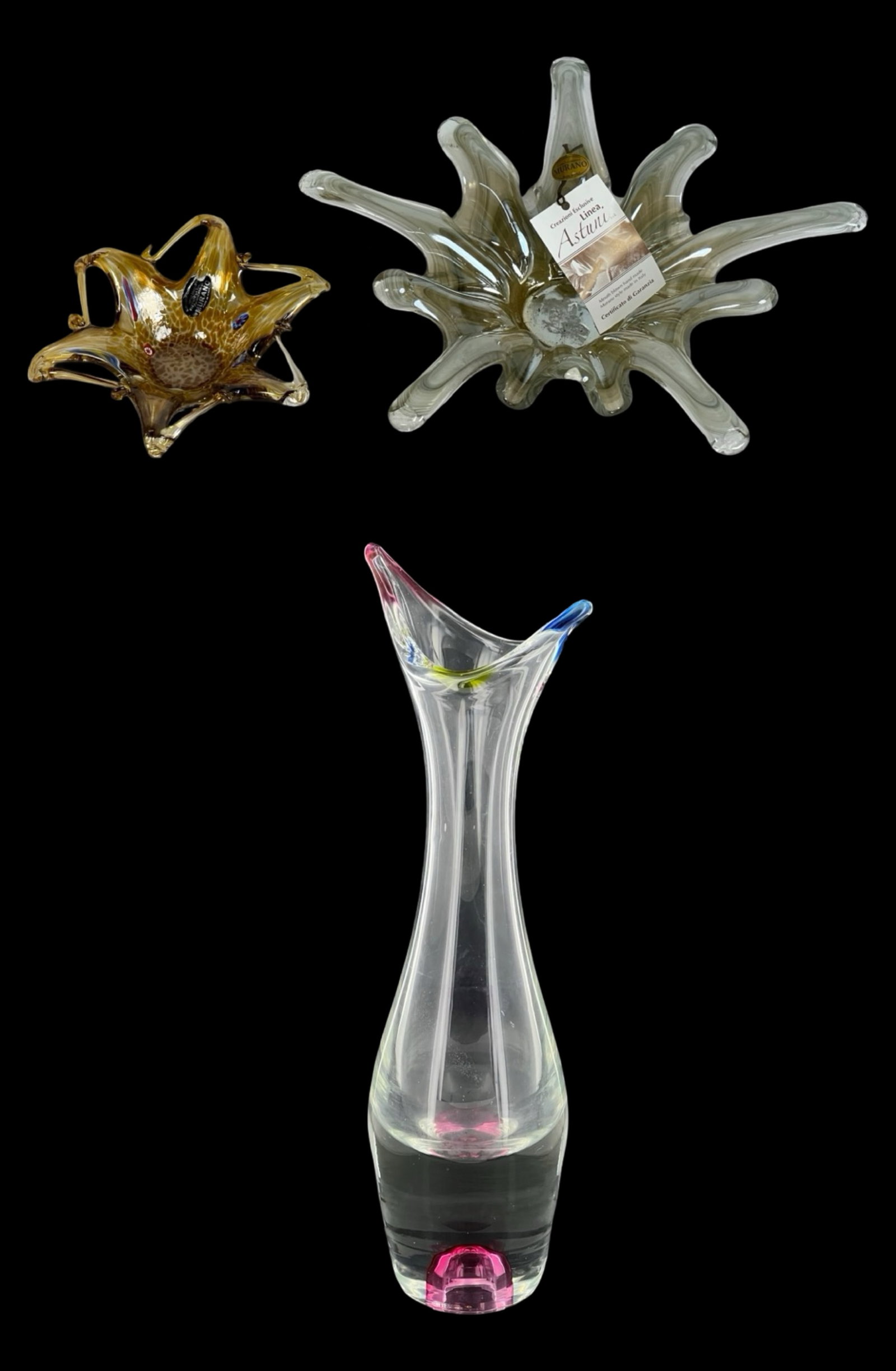 Murano Venetian Art Glass Vase and Bowls: A stunning collection of Murano Venetian art glass, featuring a tall vase measuring 16 inches and two uniquely designed bowls. The bowls measure approximately 12" x 3" and 7" x 2", showcasing the exqu