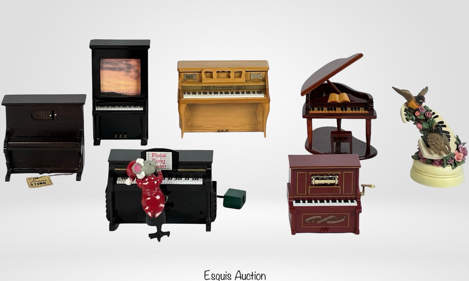 Vintage Piano-Themed Music & Trinket Boxes: A charming collection of piano-themed music boxes, trinket boxes, and decorative pieces. This lot includes a variety of materials such as porcelain, glass, enamel, wood, and resin, with intricate deta