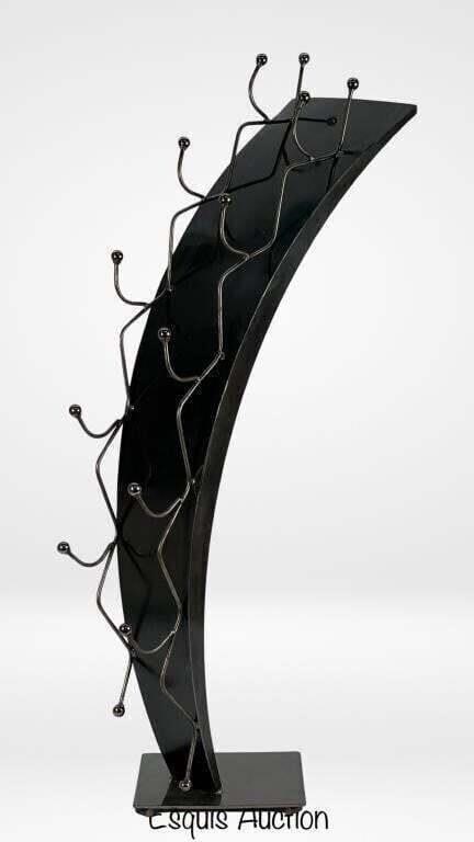 Modernist Sculptural Black Metal Wine Rack: Elevate your wine storage with this striking Modernist Sculptural Black Metal Wine Rack. Standing at an impressive 45 inches tall, this unique wine rack combines sleek design with practical functional