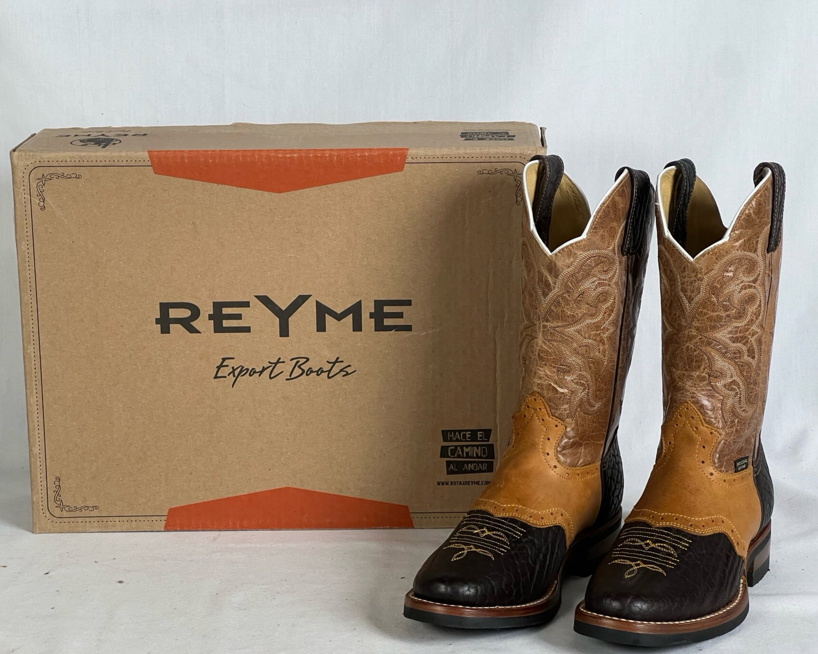 Reyme Brown & Cream Western Cowboy Boots - Sz 6.5: Brand new Reyme Export Boots in a brown and cream colorway with intricate embroidered detailing. These classic Western cowboy boots feature genuine leather construction, a stitched wing design on the 