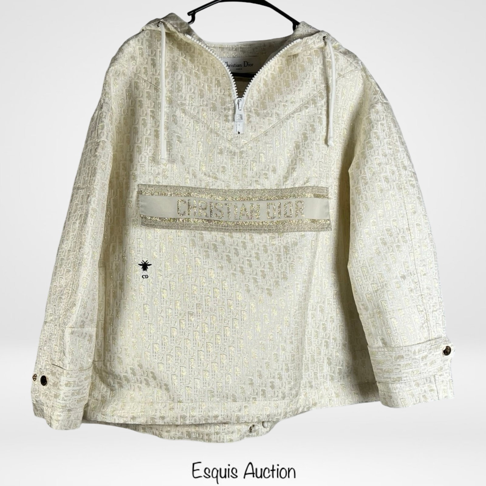 Elegant Lady's Gold Monogram Hooded Pullover: Luxurious and stylish, this gold monogram hooded pullover is designed with a shimmering jacquard pattern for a sophisticated look. The half-zip front provides versatility, while the front pouch pocket
