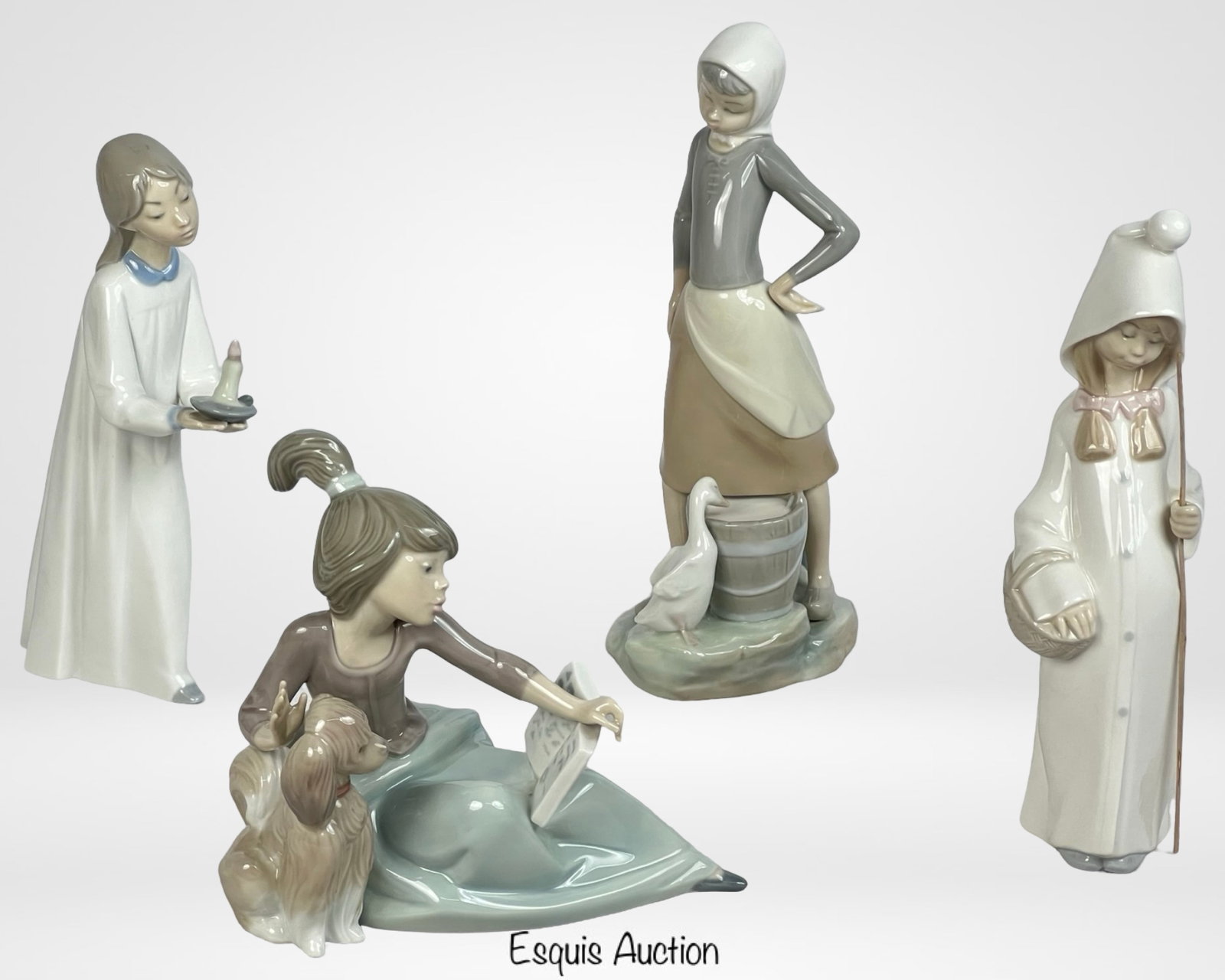 Lot of Lladro Porcelain Figurines: A charming collection of four Lladro porcelain figurines, each showcasing the brand's signature elegance and craftsmanship. allest measures 9 1/2", shortest 6". A beautiful addition to any Lladro coll