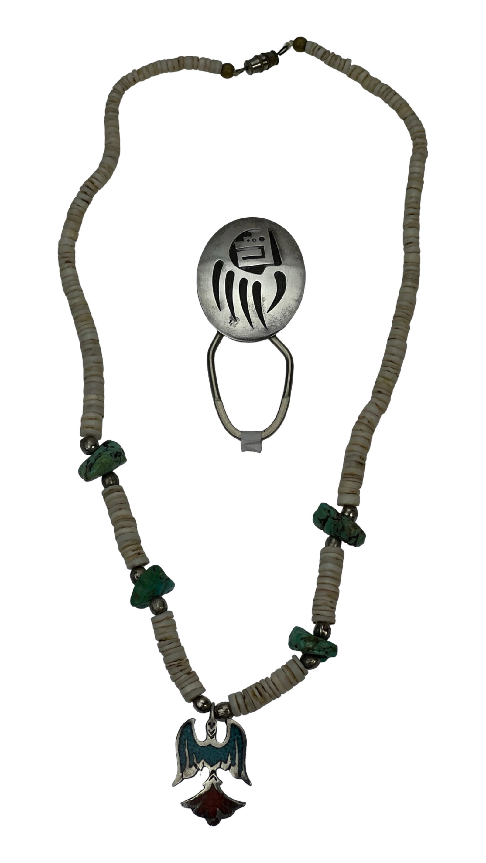 Vernon Begay Navajo Sterling Silver Bolo Tie &: This lot features a Navajo sterling silver bear paw bolo tie by Vernon Begay, showcasing a traditional cutout design with a symbolic bear paw motif. The bolo is stamped "VB" on the reverse. Also inclu