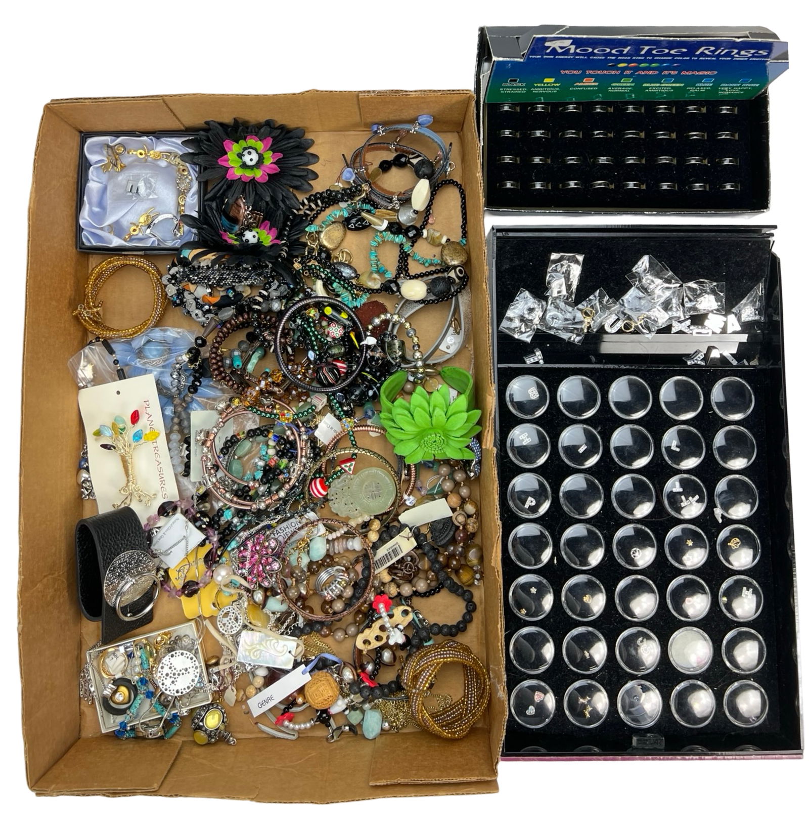 Large Assortment of Costume & Craft Jewelry: An extensive collection of fashion and costume jewelry, featuring a variety of styles, materials, and colors.Bracelets & Bangles: A mix of beaded, metal, and charm bracelets in various designs, includ