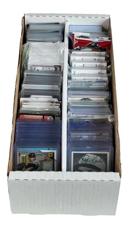 Collection of Baseball Cards with Stars: This collection of sports trading cards includes a diverse range of key highlights such as a Bo Jackson All-Star card, a Nolan Arenado refractor card, and an Adley Rutschman rookie card. The set also 