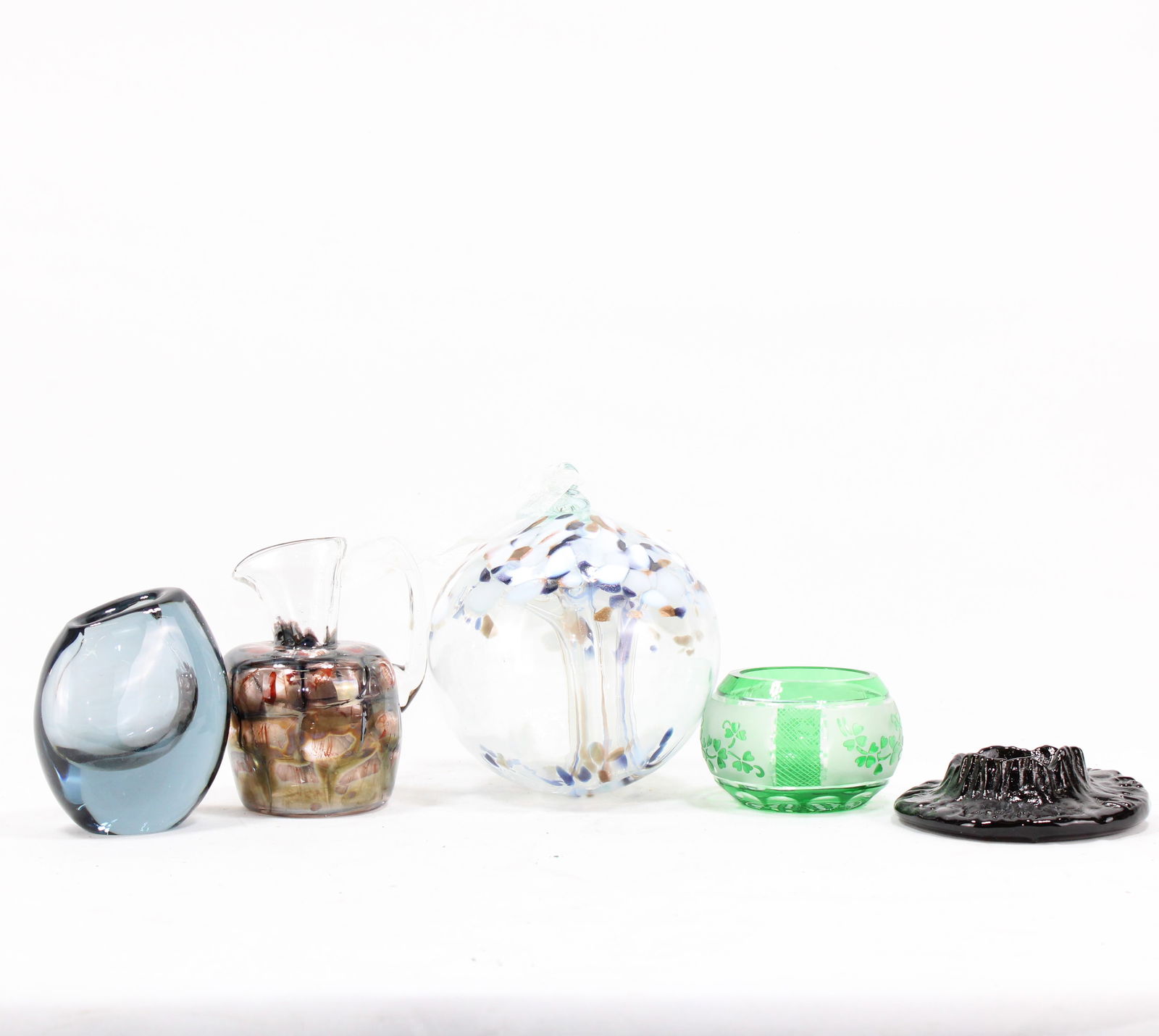 Assorted Art Glass Decor - Vases, Pitcher, and Decorative Bowls: Eclectic collection of art glass decor pieces, including a variety of colorful vases, a small decorative pitcher, and unique glass bowls. Including candle holder made from volcano ashes ( has chip ) T