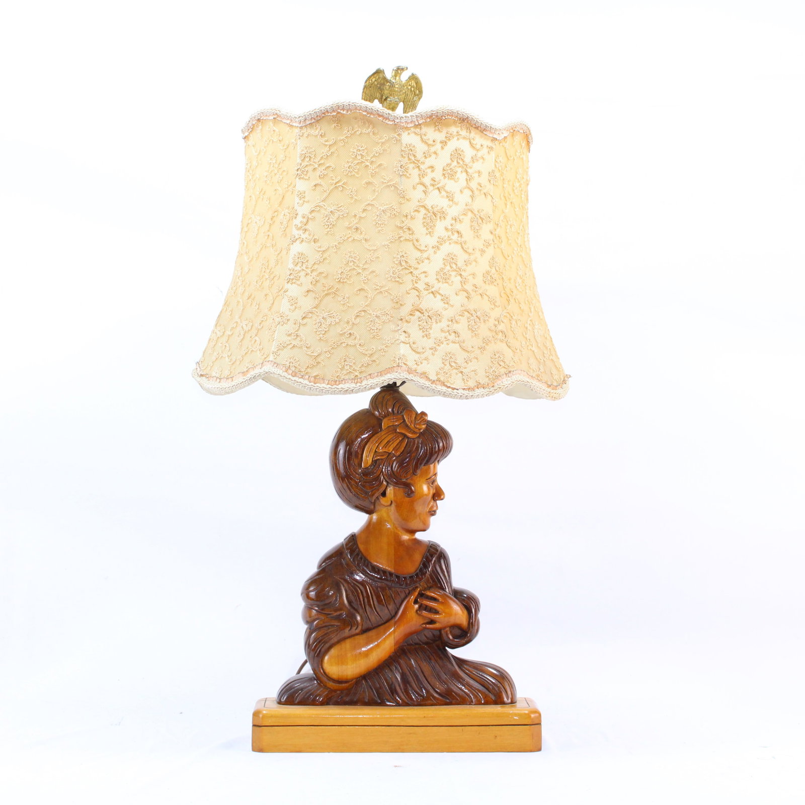 Wood carved lady lamp with vintage lace shade.: Elegant lamp featuring a carved wooden lady as the base, paired with a delicate lace shade adorned with intricate floral patterns. Topped with a charming decorative finial for added detail. Perfect bl