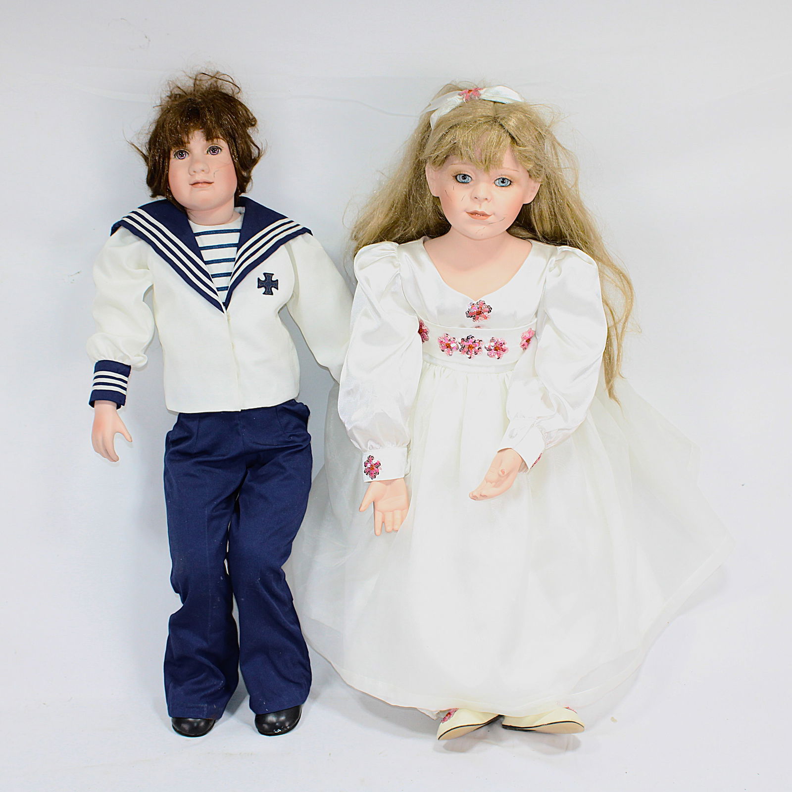 Set of 4 Porcelain Dolls in Vintage-Themed Outfits (1 of 3)