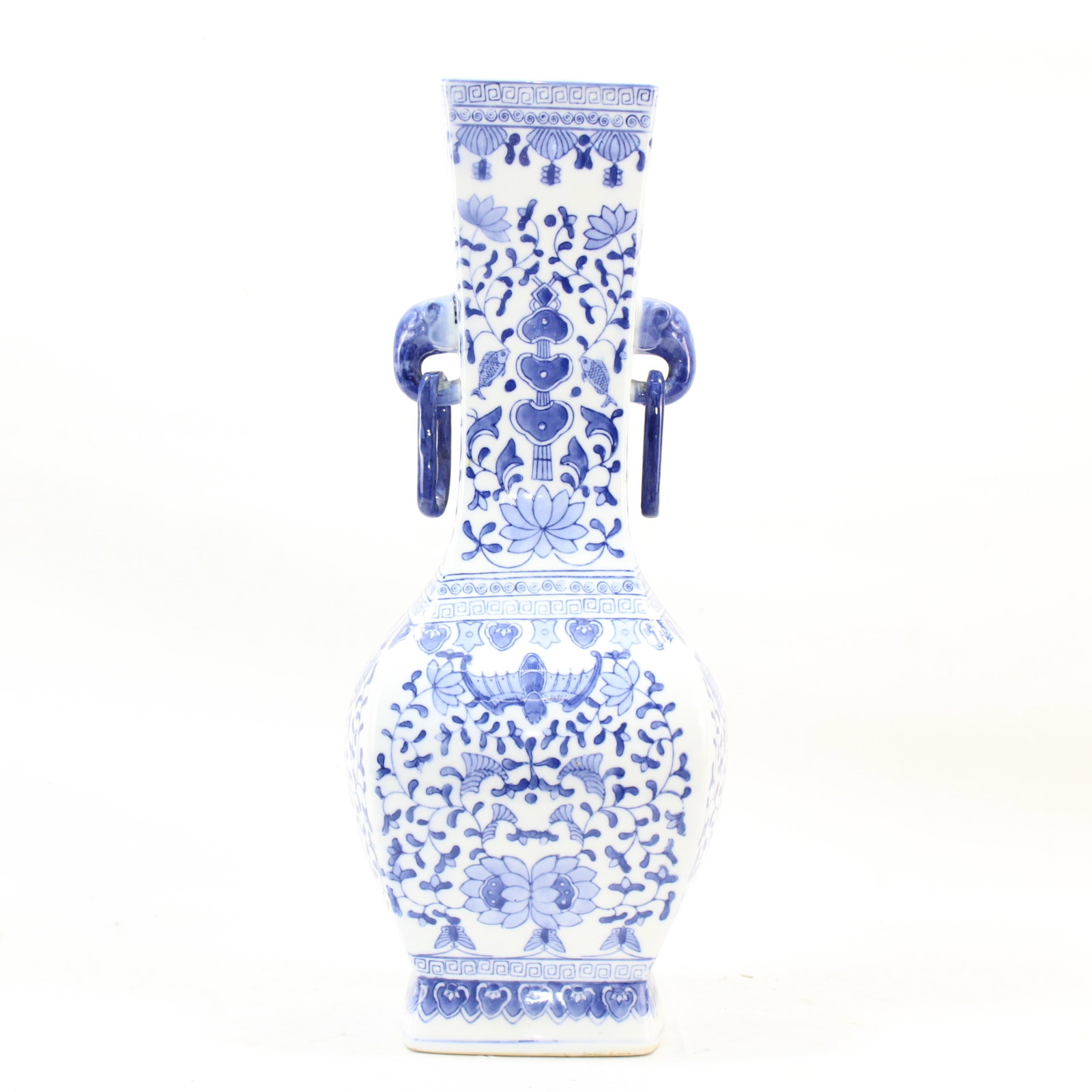 Chinese Oriental Blue and White Porcelain Vase with Handles: Stunning blue and white porcelain vase featuring traditional floral motifs and intricate patterns. Unique design includes elegant side handles, adding character and charm. A perfect decorative piece f