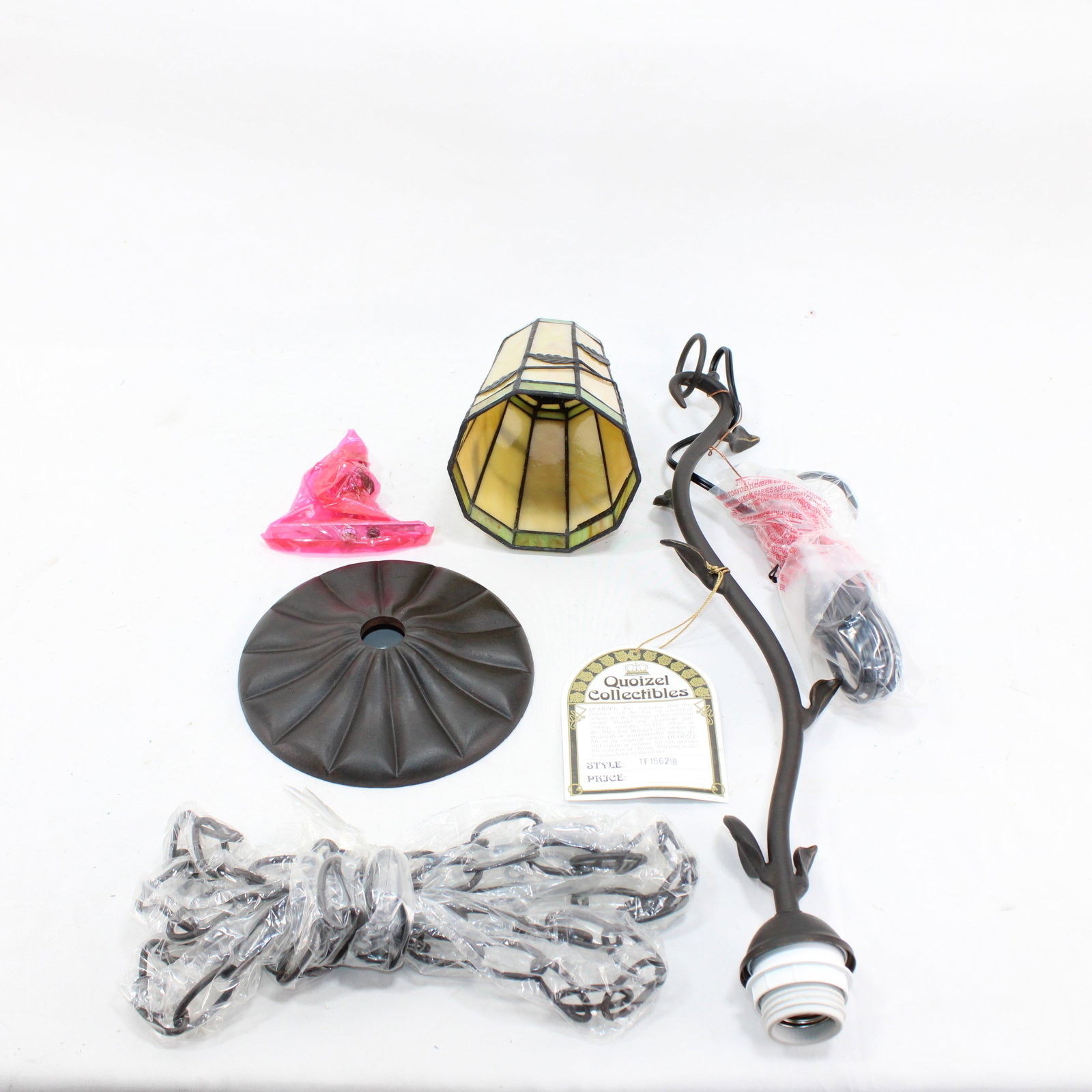 Quoizel Collectibles Pendant Light Kit: Quoizel Collectibles pendant light kit featuring a stained glass shade, metal components, and installation hardware. Classic design with a bronze finish, perfect for vintage-inspired lighting d?cor.