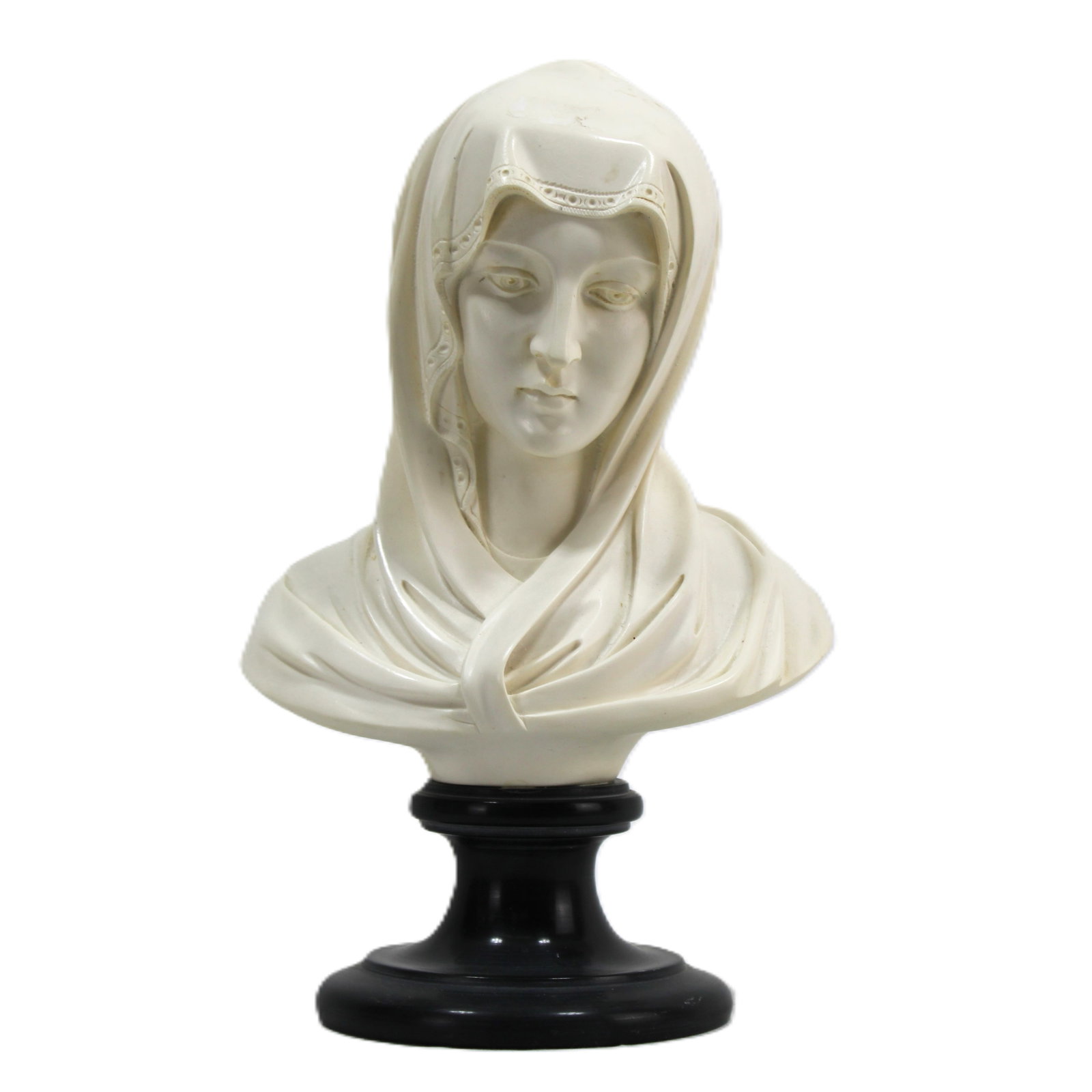 Elegant Bust of Madonna: Bust depicting Madonna, exuding grace and serenity. The sculpture is predominantly ivory-toned with delicate detailing in the veil's lace-like edges and flowing drapery. The piece is mounted on a poli