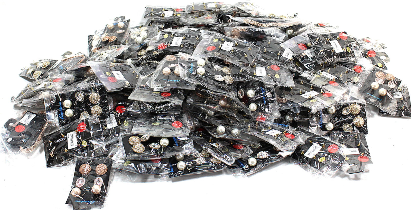Wholesale Lot of Fashion Jewelry Earrings, Necklaces, and Accessories: Extensive bulk lot of fashion jewelry featuring earrings, necklaces, and other accessories, all brand new in original packaging. A mix of styles and designs ideal for resale, crafting, or personal use