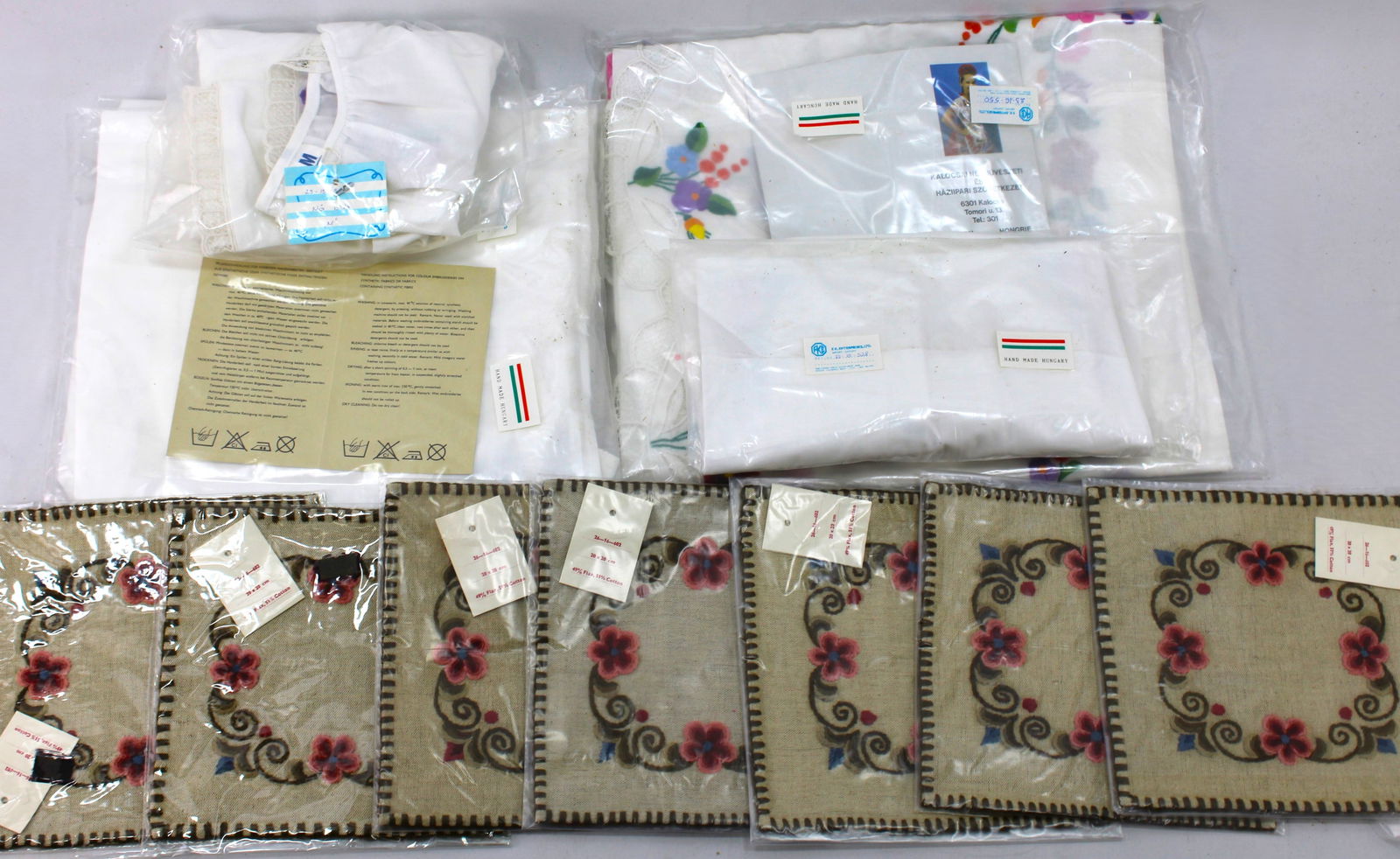 Hungarian Traditional Kaloca folk blouses and napkins: Set of handcrafted Hungarian linens, including tablecloths and napkins with intricate floral embroidery. Made with attention to detail, each piece showcases traditional Hungarian craftsmanship. Ideal