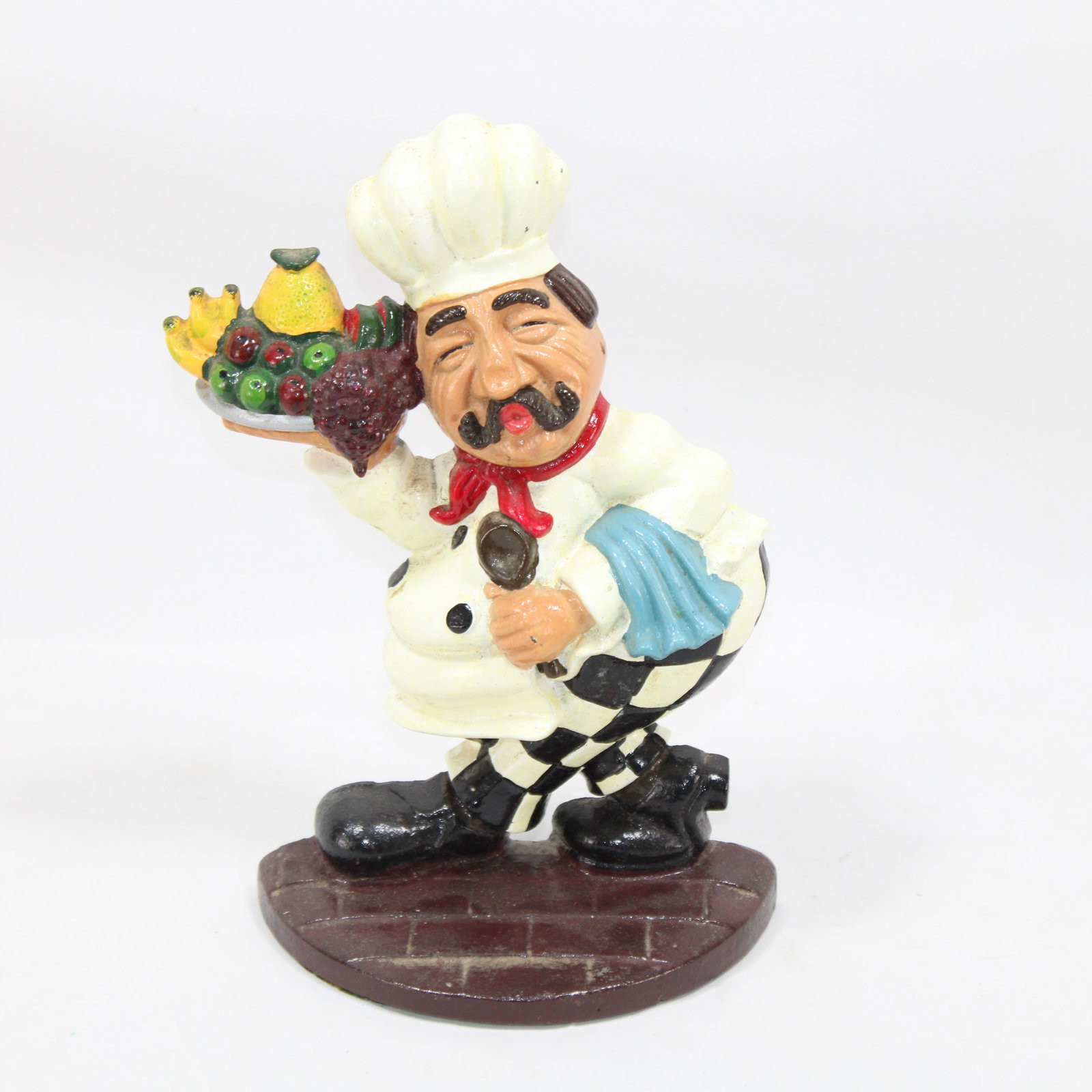 Cast Iron Chef Door Stopper by Upper Deck: Charming chef-themed door stopper featuring a hand-painted design and vibrant colors. Made by Upper Deck, this durable and functional piece adds a playful touch to any kitchen or home decor. Designed 