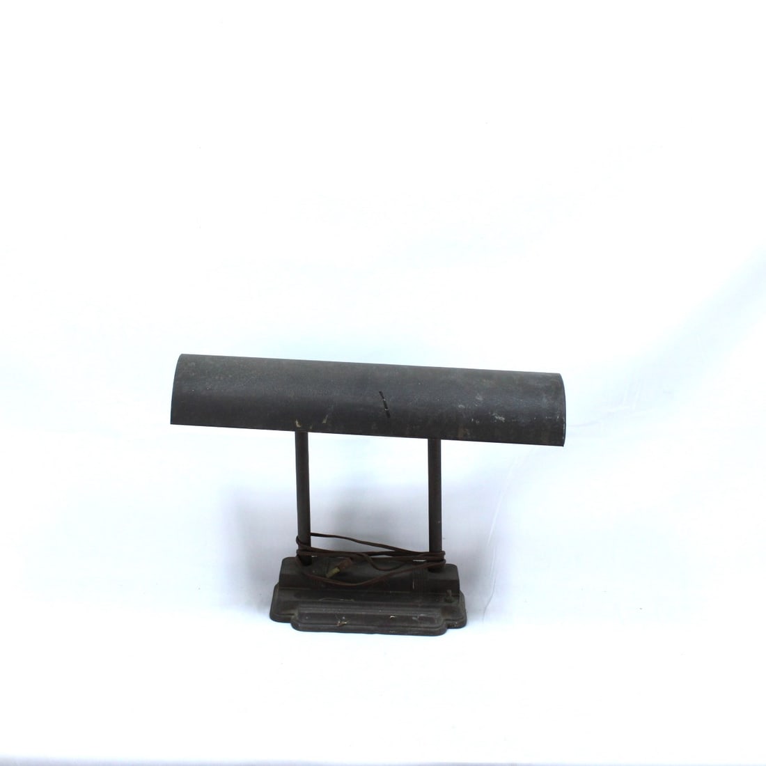Vintage industrial-style bankers desk lamp: Vintage industrial-style bankers desk lamp featuring a black metal body with a cylindrical shade and a dual-pillar design. The lamp is equipped with a fluorescent tube inside, though it remains untest