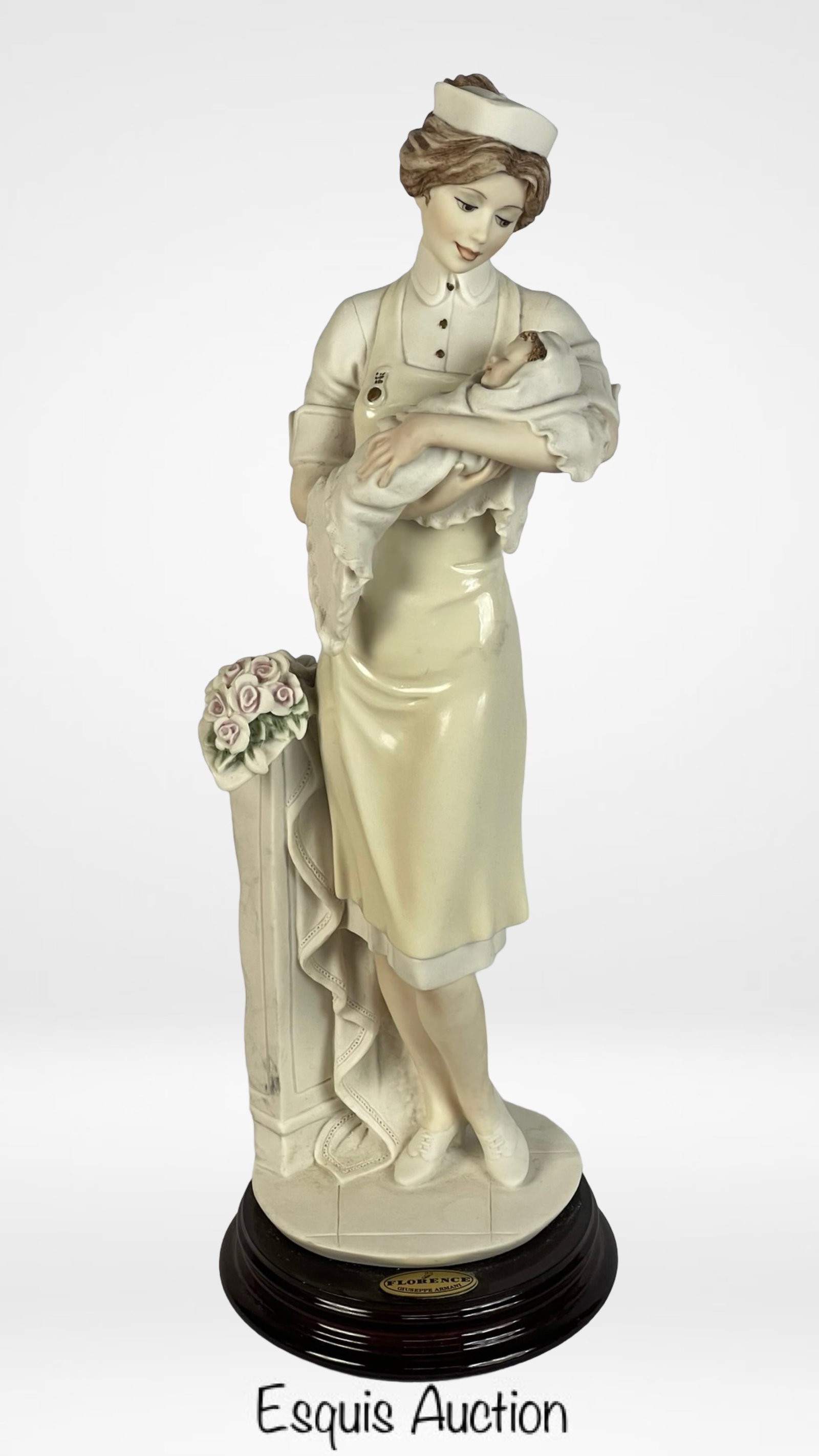 Giuseppe Armani "Nurse with Child" 0693-F Figurine: Beautiful Giuseppe Armani "Nurse with Child" (L'Infirmiera) figurine, model 0693-F, crafted in Florence, Italy. This elegant sculpture captures the warmth and compassion of a nurse gently cradling an 