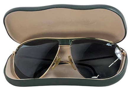 Lacoste 191 L132 Aviator Men's Sunglasses: Step up your eyewear collection with these Lacoste 191 L132 aviator sunglasses.Featuring a classic gold-tone metal frame with green accents on the bridge and temple tips, these sunglasses exude timele