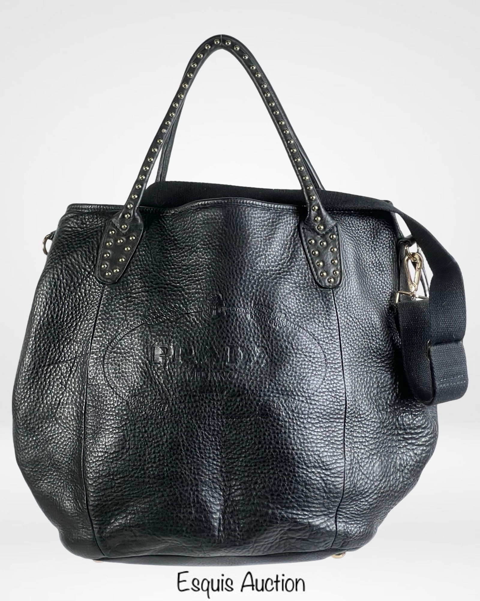 Black Cervo Lux Leather Chain Tote Bag/ Handbag: Sophisticated black leather tote bag with a soft, pebbled texture and a slouchy silhouette. Features studded detailing along the handles, gold-tone hardware, and a detachable shoulder strap for versat