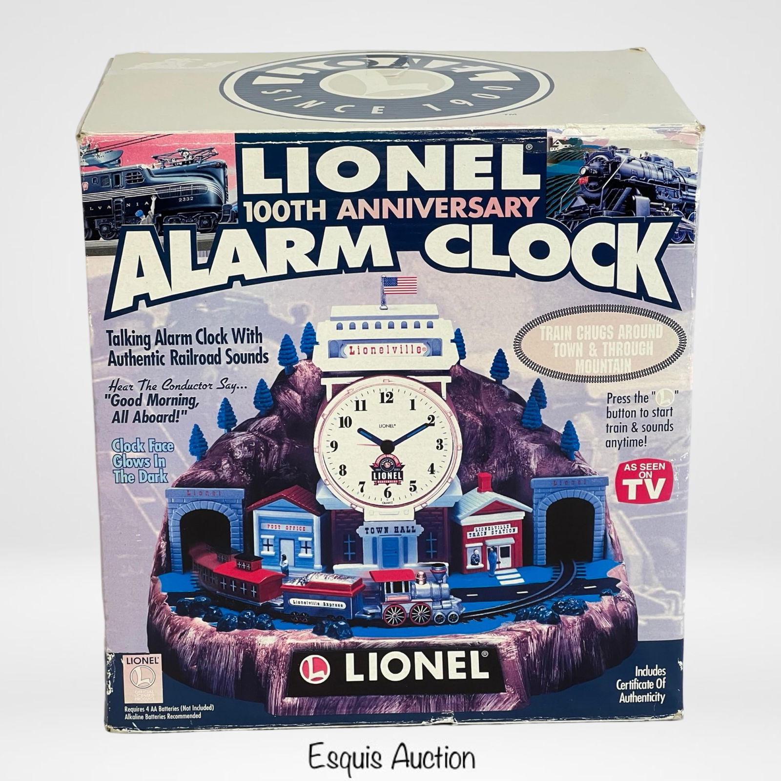 Lionel 100th Anniv. Animated Talking Alarm Clock: Limited edition Lionel Trains 100th Anniversary animated talking alarm clock. Features a train that chugs around a town and through a mountain while playing authentic railroad sounds. The clock face g