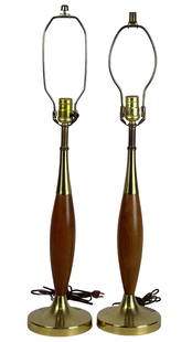 MCM Tony Paul for Westwood Walnut Brass Lamps: A pair of mid-century modern table lamps designed by Tony Paul for Westwood Industries. Each lamp features a sculpted walnut body with brass accents and a round brass base. Classic MCM design with ele