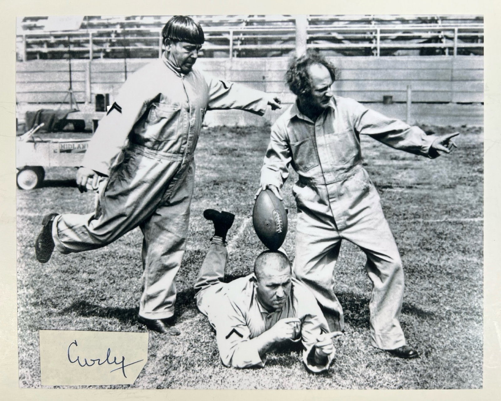 Curly "Stooge" Signature w/ 3 Stooges Photo: Curly Howard Signature Cut, a truly exceptional and rare piece of memorabilia from one of the most iconic members of the classic comedy trio, The Three Stooges. Comes with 8*10 "3 Stooges" Photograph.