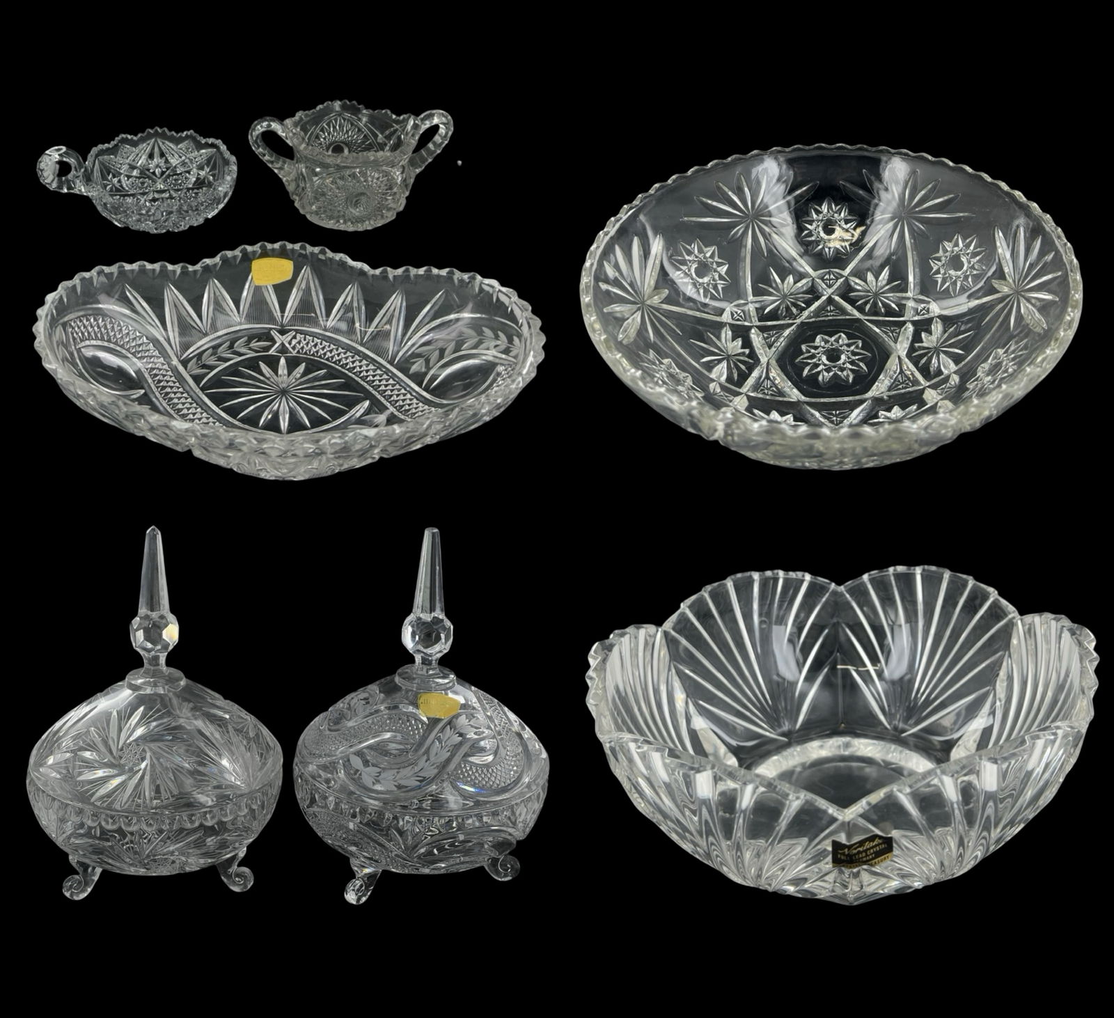 Lot of Crystal & Cut Glass Serveware: Lot of Crystal and Cut Glass Serveware & Decorative Pieces Pair of Lidded Crystal Compotes - Featuring intricate cut designs with a floral and geometric motif, standing on three ornate feet with a poi