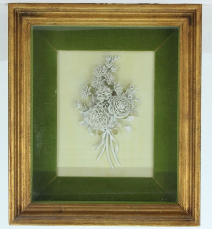 Mottahedeh Italian Bas-Relief Ceramic Flower Art in Gilded Frame: This exquisite piece of wall art by Mottahedeh Design features a delicate ceramic bas-relief of flowers, meticulously crafted and set against a vibrant green background in a beautifully gilded wooden 