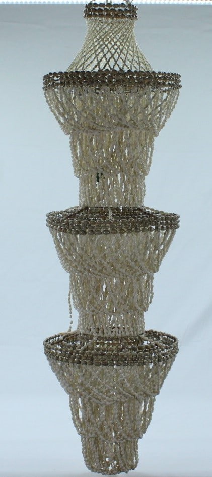 Tiered Shell Chandelier with Cascading Design: This captivating chandelier features an intricate three-tier design crafted from delicate shells, each tier varying in size to create a cascading, elegant visual effect. It's perfect for adding a natu