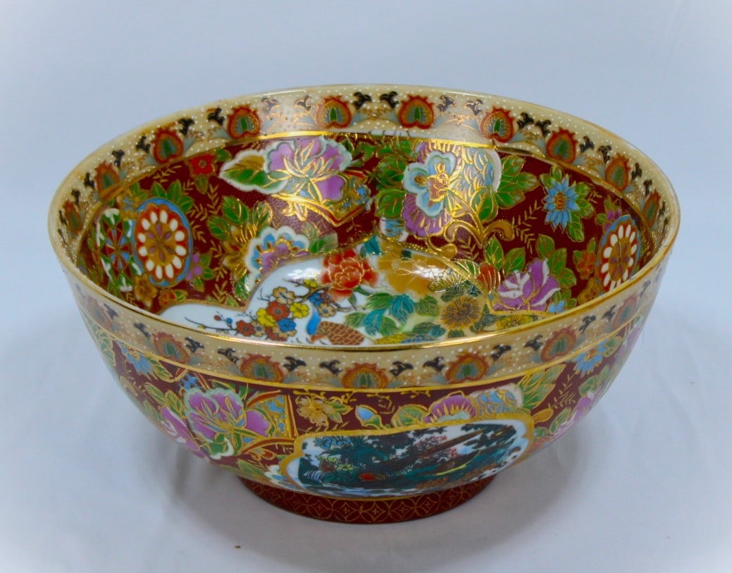 Hand-Painted Chinese Porcelain Decorative Bowl: This exquisite hand-painted Chinese porcelain bowl showcases a vibrant array of floral designs and intricate depictions of animals, including birds and tigers, all adorned with gilded accents. The ric