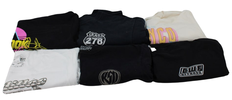 6 Graphic T-Shirts: Lot of six graphic t-shirts, including unique designs like Cadillac Ranch and a retro Ford Bronco illustration. Shirts are in mixed colors, featuring bold automotive and lifestyle graphics. Sizes vary