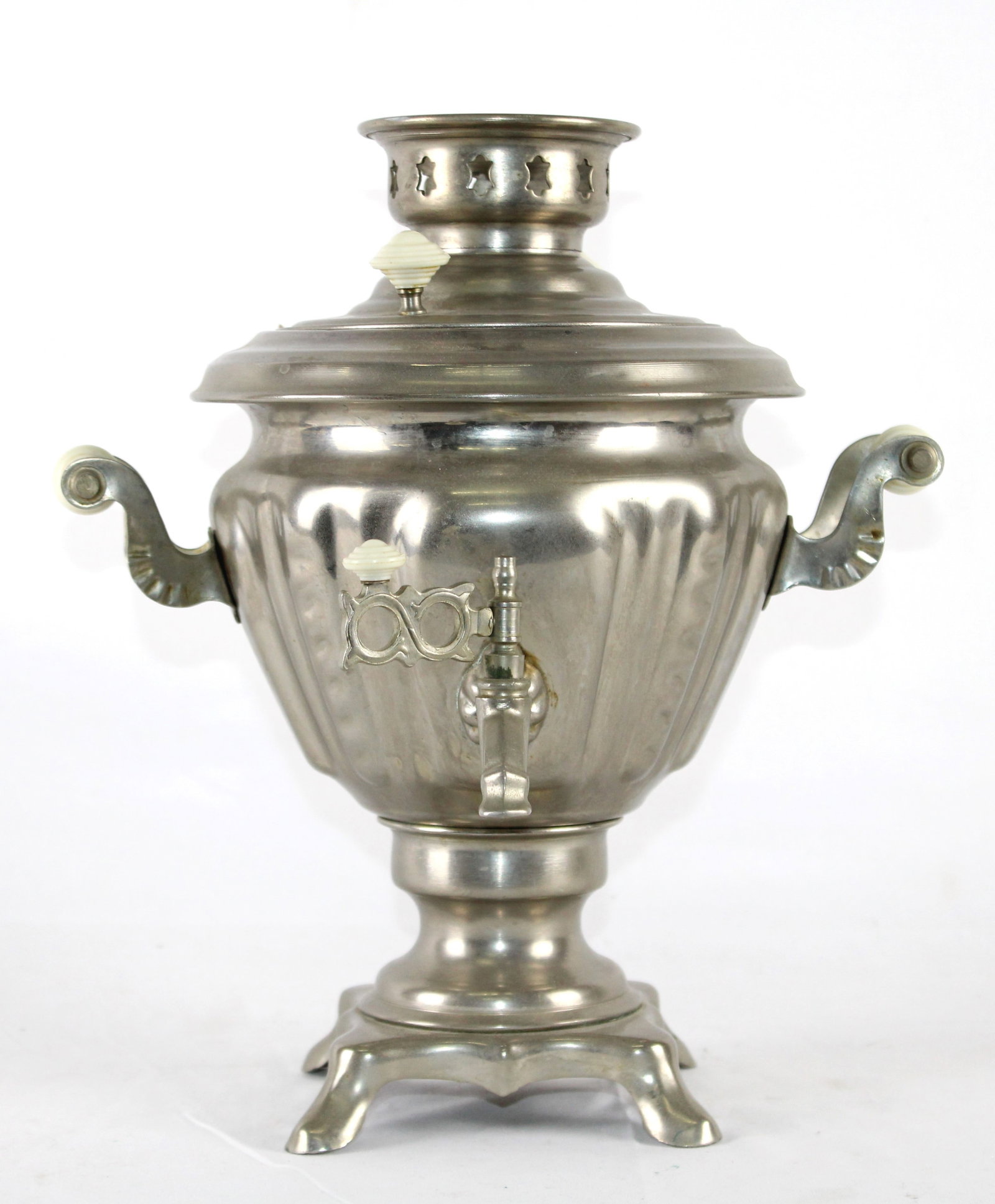 Electric Samovar Tea Maker with Elegant Handles...: and Footed Base. Classic Eastern european -style samovar crafted from polished metal, featuring ornate handles, a functional spigot, and a gracefully fluted body. Designed for brewing and serving tea,