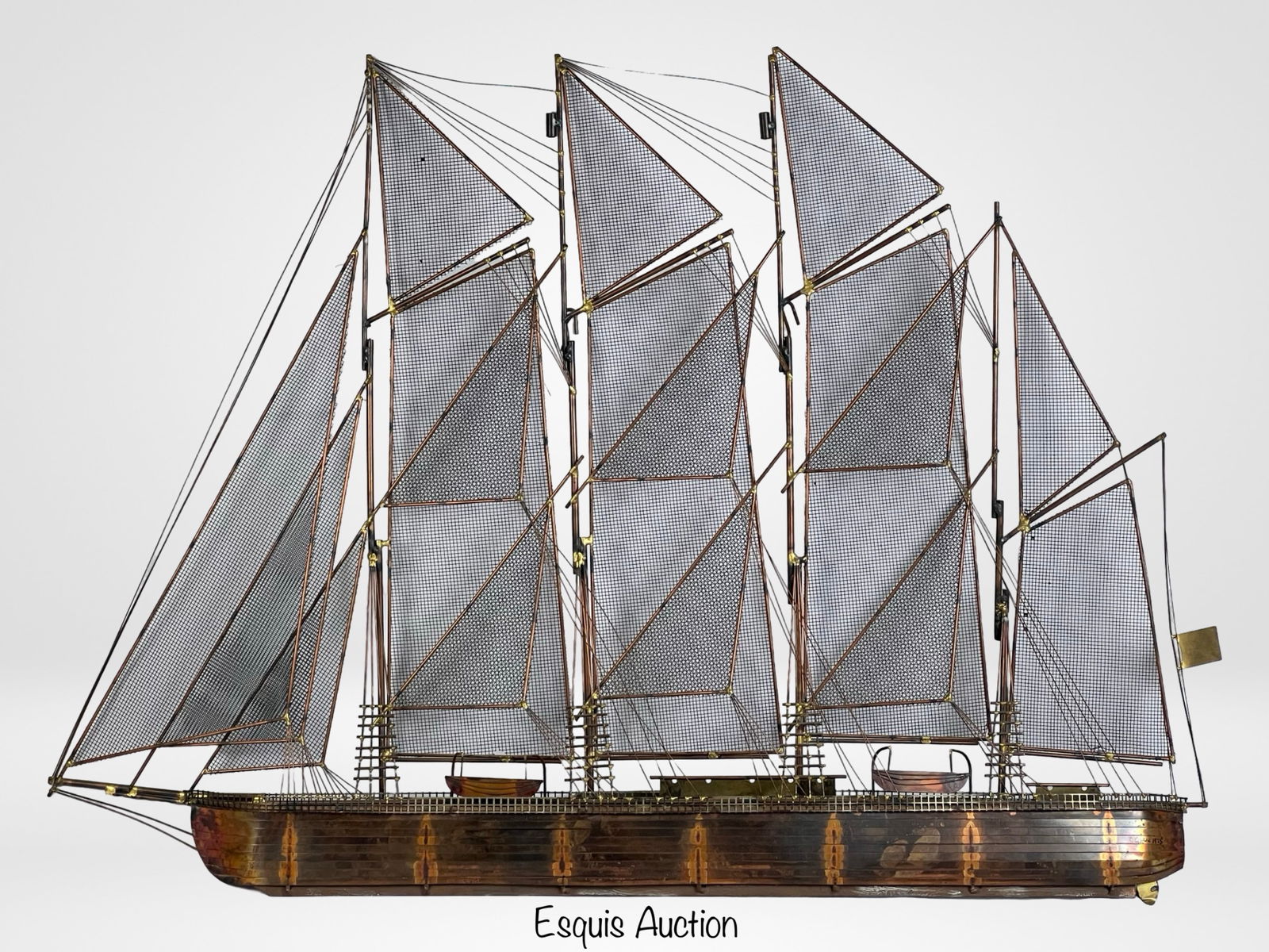Curtis Jere Clipper Ship Metal Wall Sculpture: Vintage Curtis Jere clipper ship wall sculpture featuring a striking Brutalist design in mixed metals. The piece showcases a finely crafted copper and brass hull with mesh metal sails, embodying the i