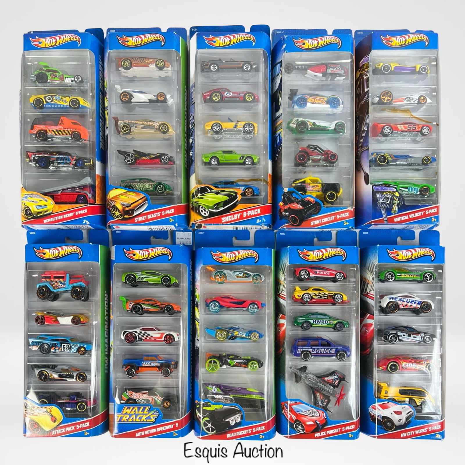 Multi-Pack Collection of Hot Wheels Diecast Cars: Collection of Hot Wheels diecast cars, featuring multiple sealed multi-packs with various themes, including Shelby, Demolition Derby, Street Beasts, Attack Pack, Auto Motion Speedway, Road Rockets, an